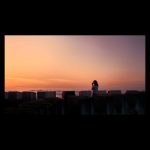 Tourist enjoys a beautiful sunset