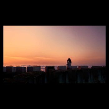 Tourist enjoys a beautiful sunset