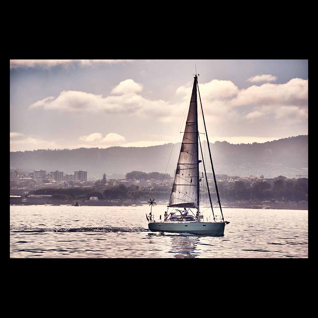 Sailboat in the Vigo estuary at sunset